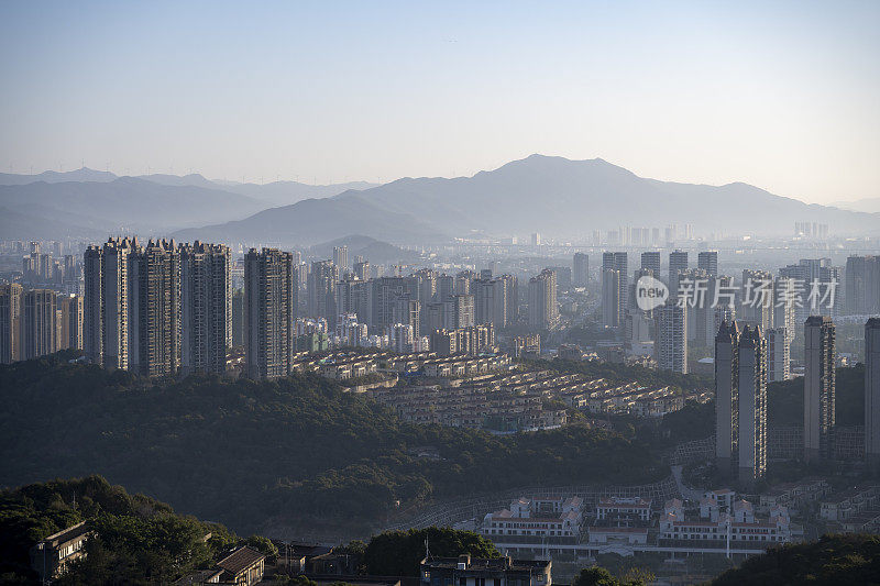 city ​​buildings in morning mist